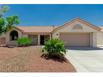 Charming single-story home featuring a desert landscape and a two-car garage at 8921 Signal Terrace Dr, Las Vegas, NV 89134