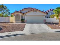 Charming single-story home with a two-car garage and low-maintenance desert landscaping at 9398 Sailing Water Ave, Las Vegas, NV 89147