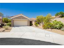 Charming single-story home with a two-car garage and xeriscaped front yard at 9525 Salem Hills Ct, Las Vegas, NV 89134