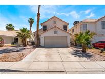 Charming two-story home featuring a two-car garage, desert landscaping, and inviting curb appeal at 1922 Falcon Ridge St, Las Vegas, NV 89142