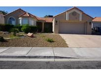 Charming single-story home with a well-maintained front yard and attached two-car garage at 2874 Tori Way, Henderson, NV 89074