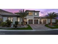 Charming two-story home featuring a three-car garage, desert landscaping and mountain views at 4220 San Alivia Ct, Las Vegas, NV 89141
