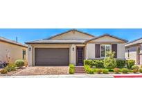 Charming single-story home with a well-maintained front yard and brick paved driveway at 5429 Blinding Lights St, North Las Vegas, NV 89081