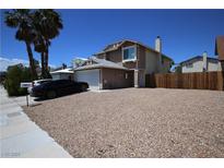 Charming two-story home featuring a spacious driveway, desert landscaping, and a well-maintained exterior at 6812 Sheffield Dr, Las Vegas, NV 89108
