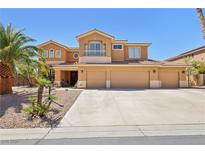 Stunning two-story home with a three-car garage and desert landscaping at 7301 Heggie Ave, Las Vegas, NV 89131