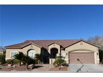 Charming single story home featuring desert landscaping, a two-car garage, and a tile roof at 7325 Rustic Crest St, Las Vegas, NV 89149