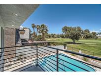 Balcony view of a sparkling pool and lush green golf course, offering a luxurious outdoor living experience at 778 Vegas Valley Dr, Las Vegas, NV 89109