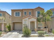 Charming two-story home featuring desert landscaping, a private entry porch, and an attached one car garage at 9065 Adorable Ave, Las Vegas, NV 89149