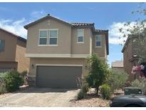 Two-story home featuring desert landscaping and a two-car garage at , Las Vegas, NV 89148