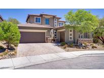 Charming two-story home with a two-car garage and lovely brick driveway at 10520 Maystar Ln, Las Vegas, NV 89135