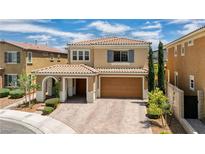 Charming two-story home featuring a tile roof, porte-cochere, and manicured landscaping at 2154 Tortona St, Henderson, NV 89044
