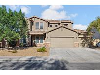 Beautiful two-story home featuring a three-car garage and well-maintained landscaping at 258 Chamomile Dr, Henderson, NV 89015