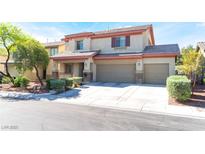 Charming two-story home featuring a three-car garage and inviting front porch at 3309 Green Ice Ave, North Las Vegas, NV 89081