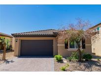 Charming single-story home with a desert-landscaped yard and a two-car garage at 6829 Painted Morning Ave, Las Vegas, NV 89142