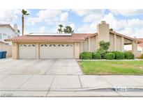 Charming single-story home with a well-manicured lawn, three-car garage, and solar panels at 8316 Vibrant Dr, Las Vegas, NV 89117
