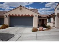 Charming single-story home featuring a two-car garage and well-maintained front yard landscaping at 9526 Borough Park St, Las Vegas, NV 89178