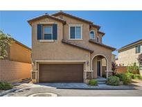 Charming two-story home featuring a two-car garage, well-maintained landscaping, and inviting front entrance at 10744 Yarmouth Bay Ct, Las Vegas, NV 89179