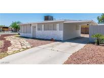 Charming single-story home featuring stone accents and a convenient carport in a sunny neighborhood at 1121 W Monroe Ave, Las Vegas, NV 89106