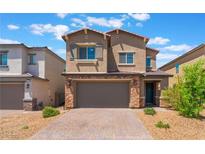 Charming two-story home featuring a paved driveway, neutral stucco exterior, and an attached two-car garage at 2767 Lindsey Springs St, Las Vegas, NV 89142