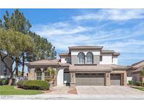 Charming two-story home with a three-car garage and well-maintained landscaping, perfect for Gathering living at 2826 Barrow Downs St, Las Vegas, NV 89135