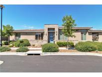 Charming single-story home with a stone accent entrance, lush landscaping, and a serene curb appeal at 4277 Sunrise Flats St, Las Vegas, NV 89135