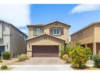 Charming two-story home with well-maintained landscaping and a paved driveway at 7819 Rachelis St, North Las Vegas, NV 89084