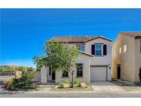 Charming two-story home with a stucco exterior, tile roof, and well-maintained front yard at 9931 Cherry Melee Ave, Las Vegas, NV 89148