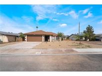 Charming single-story home featuring a well-maintained front yard with desert landscaping at 1356 Spague St, Henderson, NV 89011