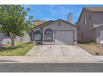 Charming single-story home featuring a clean stucco facade, two arched windows, and a one-car garage at 1622 Lorna Dr, Henderson, NV 89011