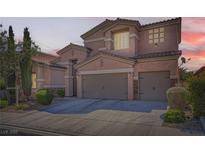Beautiful two-story home featuring a well maintained landscaped front yard with a spacious two car garage at 280 Goldstar St, Henderson, NV 89012