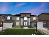 Stately two-story home featuring a manicured lawn and a welcoming double-door entrance at 358 Whispering Tree Ave, Las Vegas, NV 89183