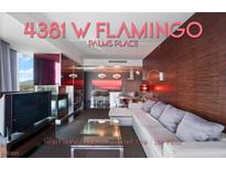 Contemporary living room with a sleek fireplace, kitchen bar and city views at 4381 W Flamingo Rd # 2122, Las Vegas, NV 89103