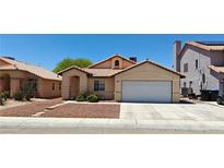 Charming single-story home with a well-maintained front yard and a two-car garage at 4619 Reliant St, North Las Vegas, NV 89031