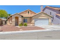 Charming single-story home with well-maintained landscaping and a spacious two-car garage at 4619 Reliant St, North Las Vegas, NV 89031