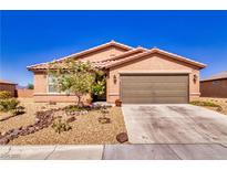 Charming single-story home with a desert-landscaped front yard and a two-car garage at 5460 Chippewa, Pahrump, NV 89061