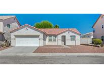 Charming single-story home with a well-maintained exterior and desert landscaping at 5622 Sage Pines Dr, Las Vegas, NV 89118