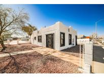 Charming single story home featuring a unique architectural style and desert landscaping at 603 W Adams Ave, Las Vegas, NV 89106