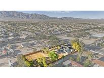 Expansive aerial view of the property with distant mountain views and surrounding neighborhood at 6920 Bradley Rd, Las Vegas, NV 89131