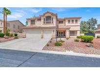 Stunning two-story home featuring a tile roof, balcony, and a two-car garage at 7310 Heggie Ave, Las Vegas, NV 89131