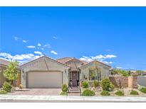 Charming single-story home featuring a well-maintained front yard, desert landscaping, and an attached two-car garage at 8269 Skye Peak St, Las Vegas, NV 89166