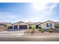 Charming single-story home with a three-car garage and well-maintained desert landscaping at 8665 Jerlyn St, Las Vegas, NV 89113
