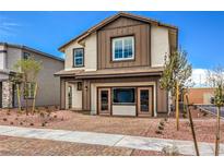 Charming two-story home with a well-maintained front yard and a two car garage at 1013 Gentle Swan St # 696, Henderson, NV 89011