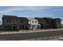 Modern townhomes with unique architectural details and beautiful color schemes are featured at 156 Silver Run Ln, Las Vegas, NV 89138