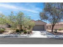 Charming single-story home with desert landscaping and a two-car garage in a quiet neighborhood at 2799 Alnwick Ct, Henderson, NV 89044