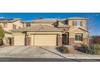 Beautiful two-story home with a three-car garage and stone accents at 368 Misty Moonlight St, Henderson, NV 89015