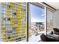 Spacious windows offer city views in this modern home with seating area, a perfect perch to observe the Las Vegas skyline at 3726 Las Vegas Blvd # 2410, Las Vegas, NV 89158