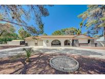 Charming single-story home with a three-car garage and decorative metalwork at 4030 Del Monte Ave, Las Vegas, NV 89102