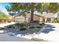 Charming single-story home with a well-maintained front yard featuring mature trees and desert landscaping at 4378 Cherrystone Ct, Las Vegas, NV 89121
