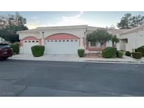 Charming home featuring a two-car garage, desert landscaping, and inviting curb appeal at 5165 Briar Meadow Way, Las Vegas, NV 89118