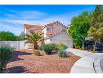 Charming two-story home featuring a well-maintained front yard and a two-car garage at 1011 Pearl Marble Ave, North Las Vegas, NV 89081
